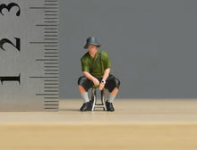 Load image into Gallery viewer, 1:64 Painted Figure Model Miniature Resin Diorama Sand Sitting Cool Hat Man Boy