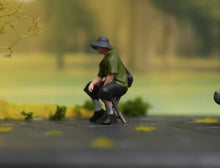 Load image into Gallery viewer, 1:64 Painted Figure Model Miniature Resin Diorama Sand Sitting Cool Hat Man Boy
