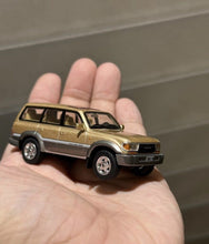 Load image into Gallery viewer, Masdi 1:64 1994 Gold Land Cruiser LC80 ORV Sports Model Diecast Metal Car New Collection
